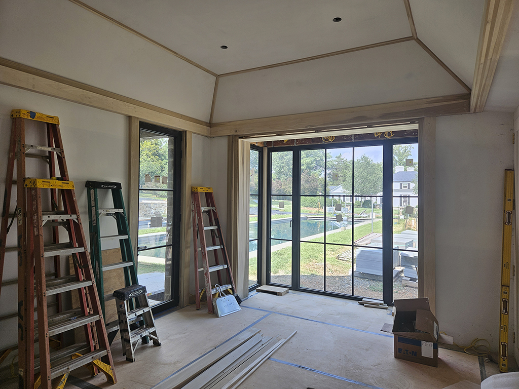 Trim install for poolhouse interiors.