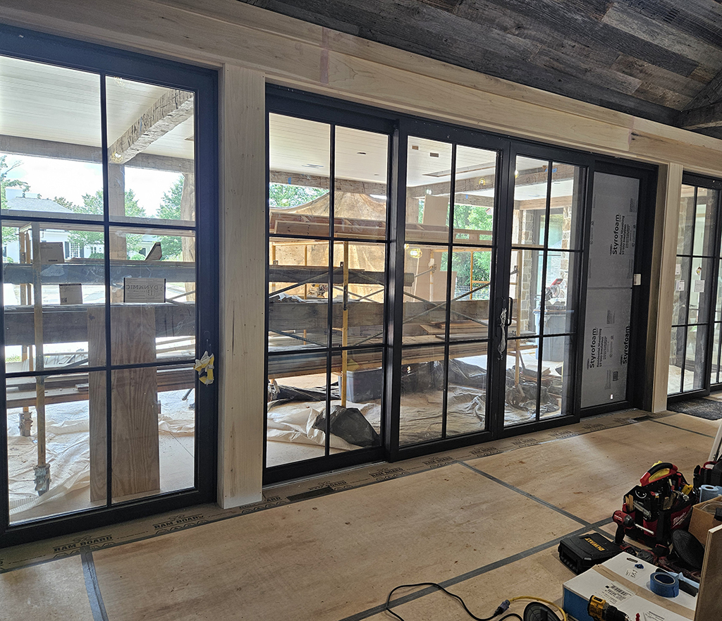Trim install for poolhouse lift and slide doors.