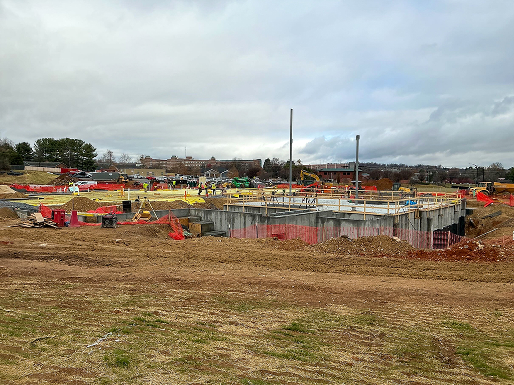 Overall progress on concrete foundation and beginning of steel